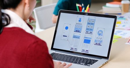Website designer, Creative planning phone app development template layout framework wireframe design, User experience concept, Young asian woman UX designer working on smartphone application at office