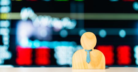 a-wooden-investor-model-sits-on-a-table-with-a-background-of-stock-charts-and-rising. A PRACTICAL GUIDE TO OPERATIONALISING PDPC'S AI GOVERNANCE FRAMEWORK IN HR RECRUITMENT